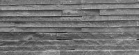 Rivestimento muri in pietra nera a liste sottili